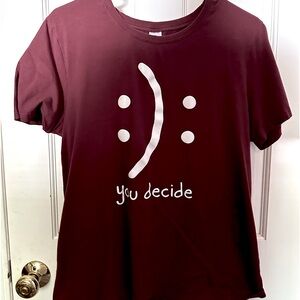 Maroon T-Shirt with writing design.